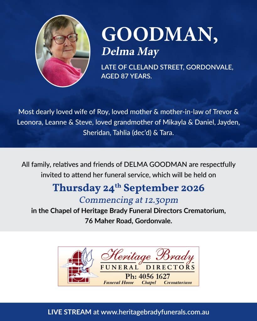 Memorial banner with a circular photo of an elderly woman in a pink sweater on the left and the name goodman, delma may in white text on a dark blue background, announcing her obituary details.